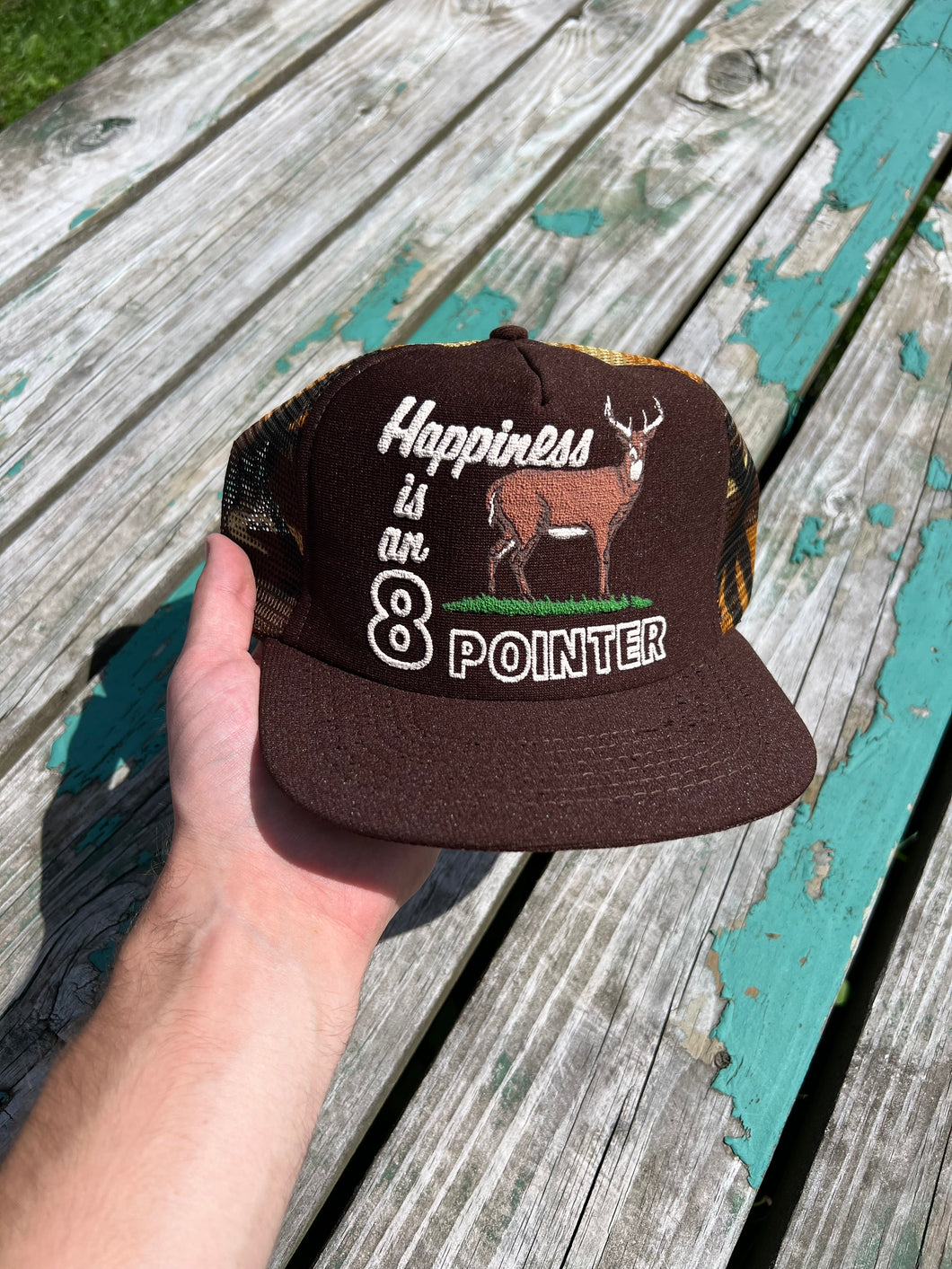 Vintage Happiness is an 8 Pointer Puffy Print Trucker Hat